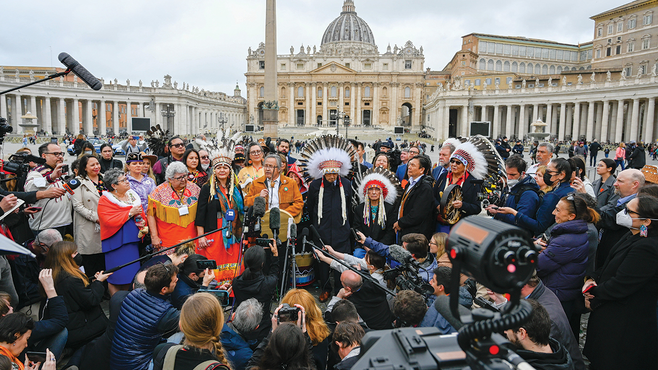 Members of the media gather around a delegation of Indigenous Canadians on March 31 in St. Peter’s Square at the Vatican. About 75 reporters from Canada, the United States and Europe were in Rome for the visit by Indigenous people with Pope Francis. — Fred Cattroll/Assembly of First Nations