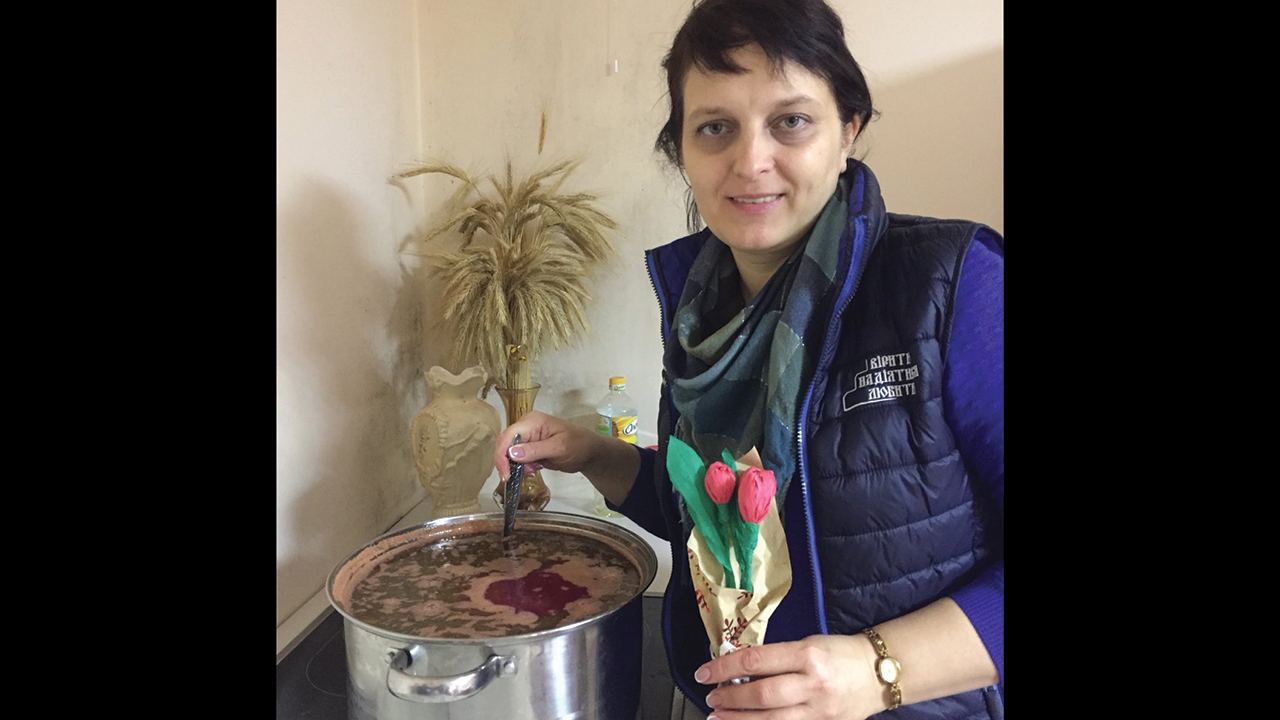 MCC staff member Anna made a pot of borscht at a refugee shelter assembled with support from MCC by an Evangelical Baptist church in western Ukraine. The flowers were a gift from her youngest daughter to mark International Women’s Day on March 8. — Mennonite Central Committee