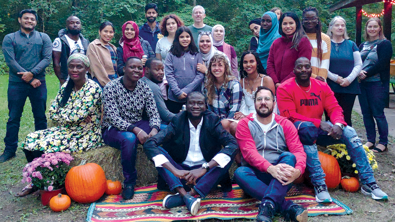 Neighbor to Neighbor volunteers and newcomers participate in a fall festival last year. The South Bend, Ind., organization helps immigrants get to know their new community. — Neighbor to Neighbor