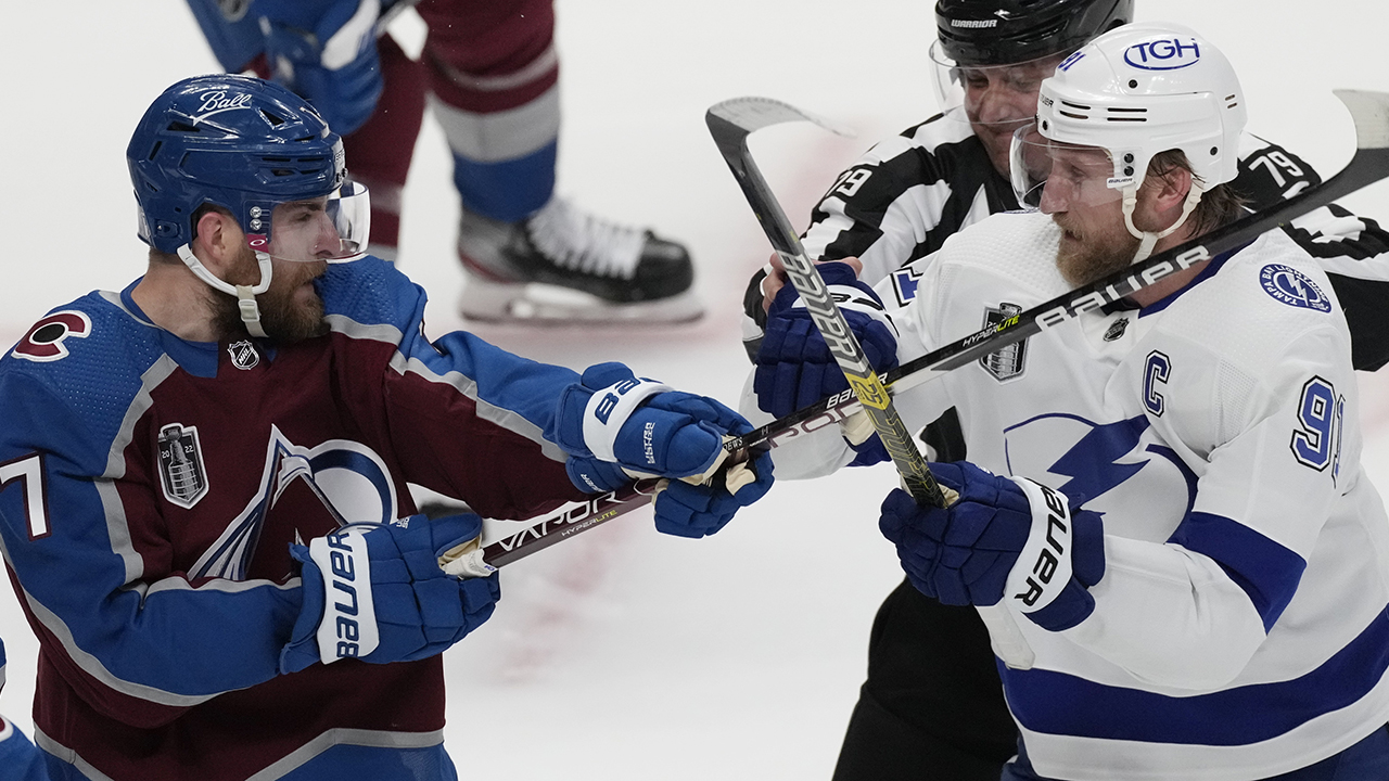 Colorado Avalanche defenseman Devon Toews, left, clashes with Steven Stamkos of the Tampa Bay Lightning June 18 during Game 2 of the Stanley Cup Final. — David Zalubowski/AP