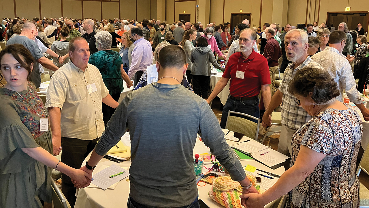 Delegates sing after moderator Linda Dibble announced the result of the vote on the “Repentance and Transformation” resolution May 29. — Paul Schrag/AW