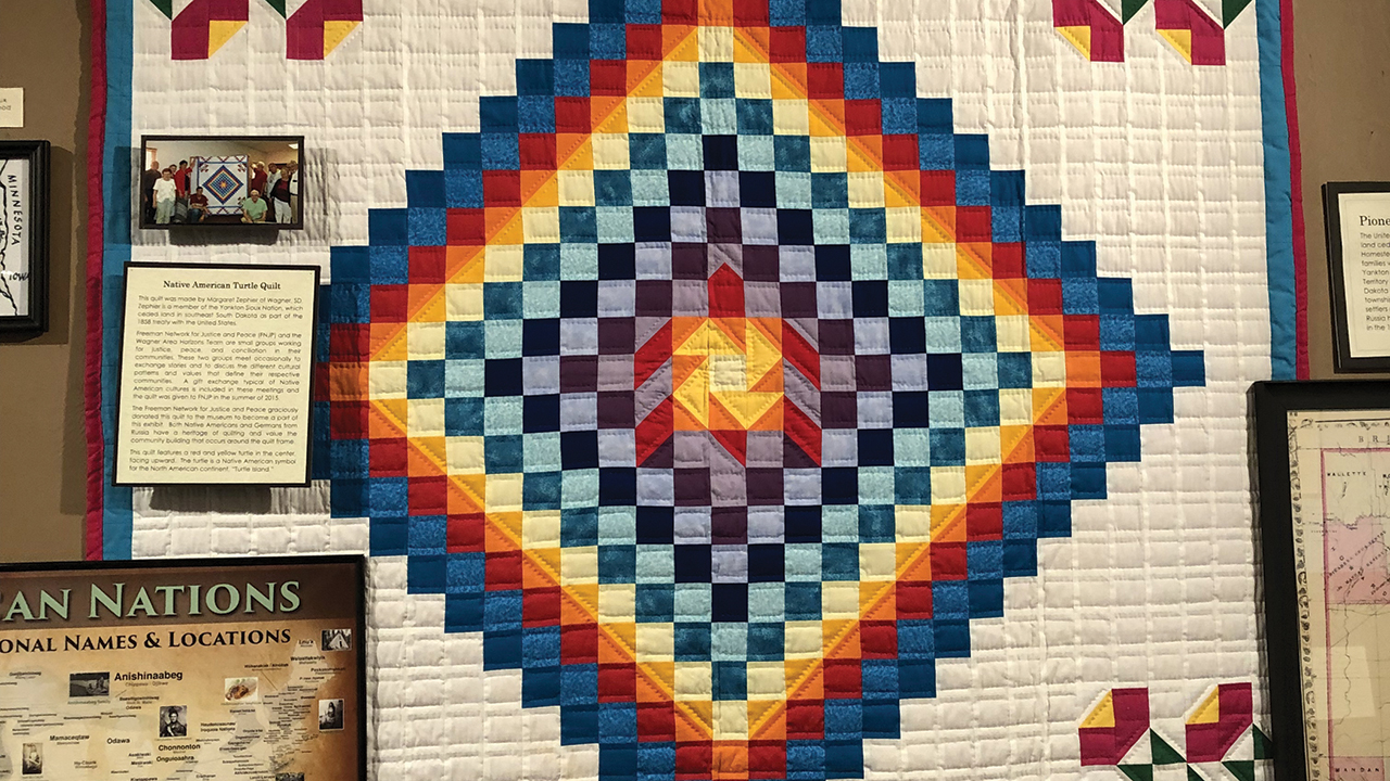 This quilt, featuring a turtle at the center, was gifted by East River Horizons, an Indigenous group in Wagner, S.D., to the Freeman Network for Justice and Peace. It hangs in the Freeman Heritage Museum. — Jenelle Ortman/Scattered Seeds