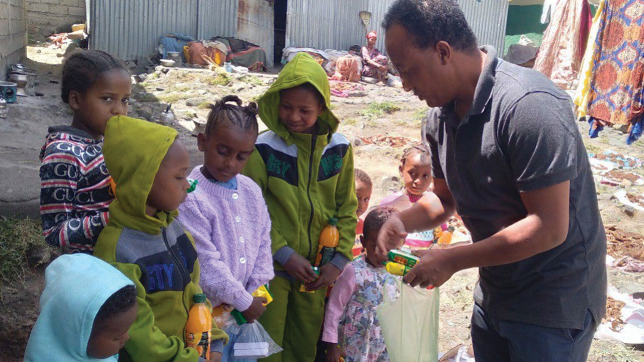 Yosef Haile, a member of the Meserete Kristos Church Prison Ministry in Ethiopia, donates items to children who live in Fitche Prison with incarcerated parents. — Meserete Kristos Church