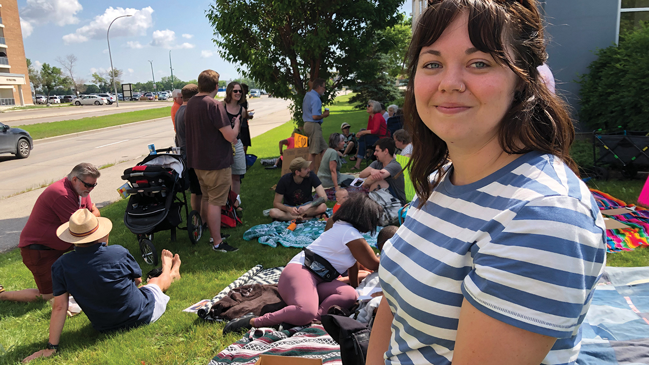 Picnic protest organizer Karissa Durant gathers with others outside the Canadian Conference of Mennonite Brethren Churches office in Winnipeg, Man., to register their disappointment with a decision to remove pages about LGBTQ inclusion from a book writen by female MB leaders. — John Longhurst