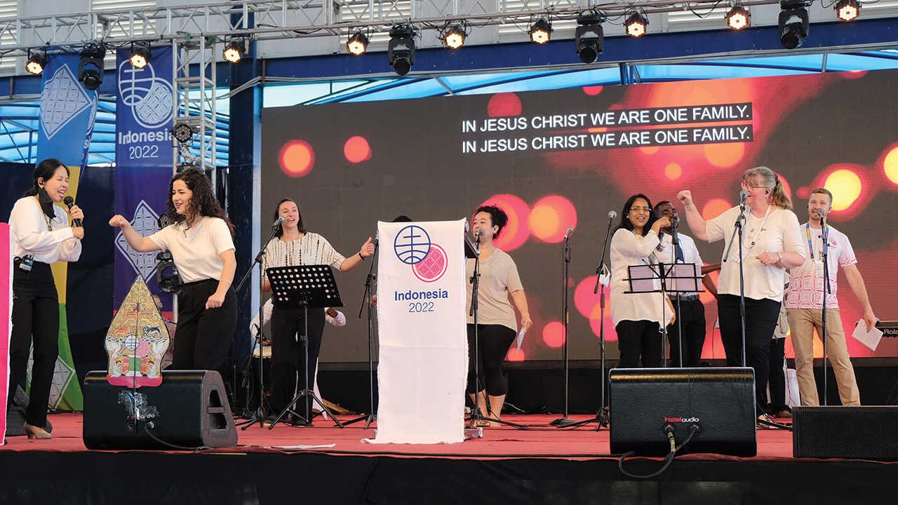 International Ensemble singers greet one another with fist bumps during the morning worship service on July 6 at the Mennonite World Conference assembly in Salatiga, Indonesia. — Kresna Kurniawan