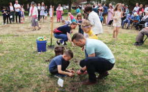 Members of Berkey Avenue Mennonite Fellowship plant trees on Good Friday. — Phil Bauman