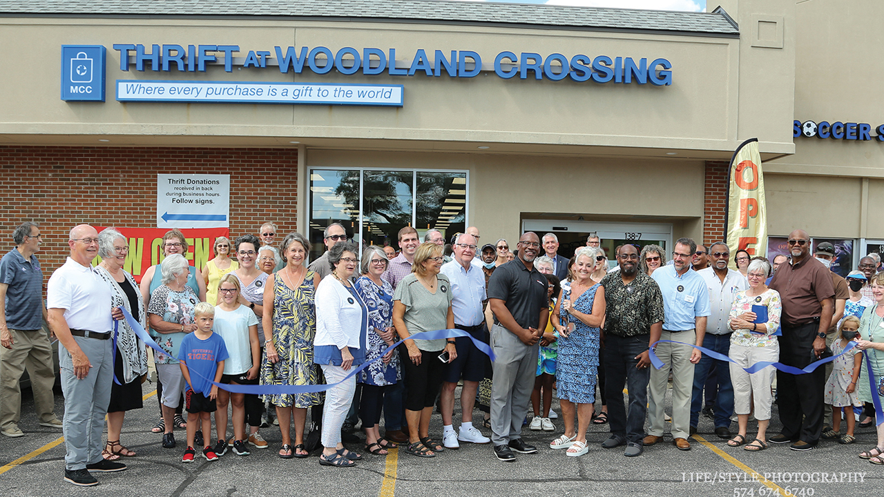 Store manager Judy Miller, center, cuts the ribbon at the grand opening of Thrift at Woodland Crossing on Aug. 18 in Elkhart, Ind. — Life/Style Photography