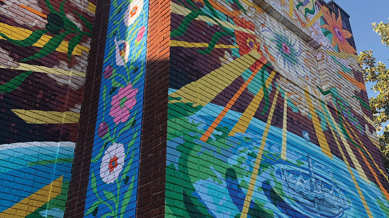 Cincinnati Mennonite Fellowship’s new mural includes symbols referencing priorities of peace and justice. — Cincinnati Mennonite Fellowship