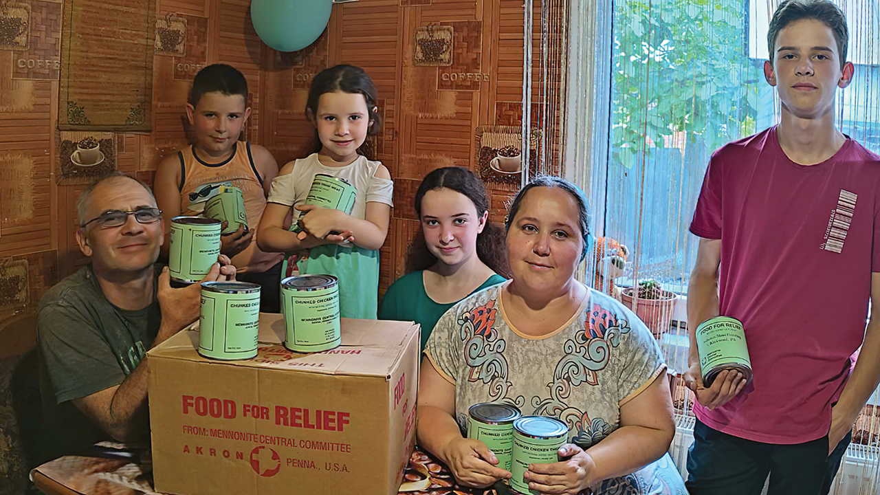 Sasha, left, and Natasha, with four of their five children in the Kharkiv region of Ukraine, received Mennonite Central Committee canned meat this summer. — All-Ukraine Platform for Health Improvement of Society