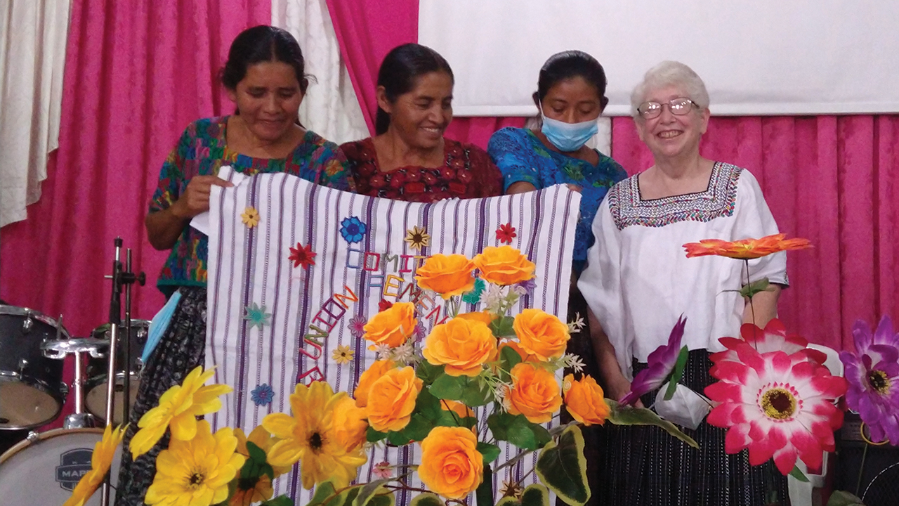 Romelia Pop, María Pa and Silvia Bo present to Deb Byler a gift from the women’s committee of the Carchá region at a farewell service in Carchá, Guatemala. — Linda Shelly/MMN