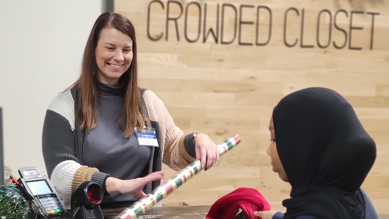 Volunteer cashier Jennifer Norton, left, and customer Rawan Ibrahim at the Crowded Closet in Iowa City, Iowa. — Julie Birky