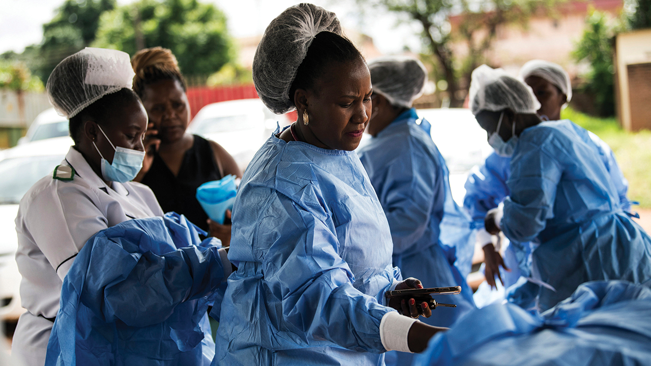 Health workers prepare to see patients suffering with cholera at Bwaila Hospital in Lilongwe, Malawi, on Jan. 11. — Thoko Chikondi/AP