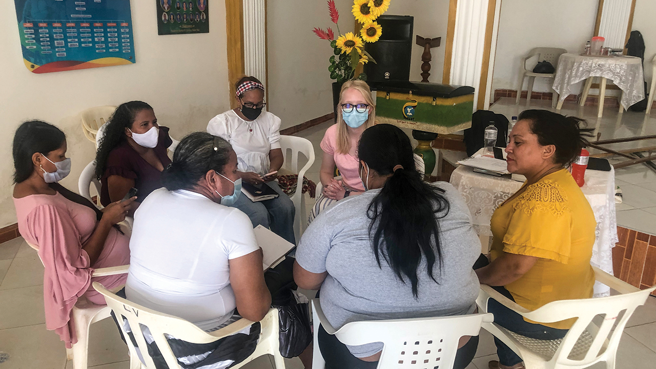 Mennonite Mission Network worker Bekah York, right, meets with women in Colombia to hear about the work in their churches. — MMN