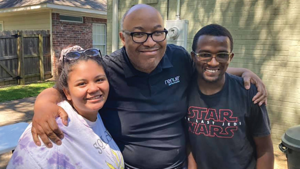 Service Adventure participants Jocelyn Baker, left, and Malachi Lind, right, with Horace McMillon, pastor of Open Door Mennonite Church, host congregation for the Jackson, Miss., Service Adventure unit in 2021. — Mennonite Mission Network