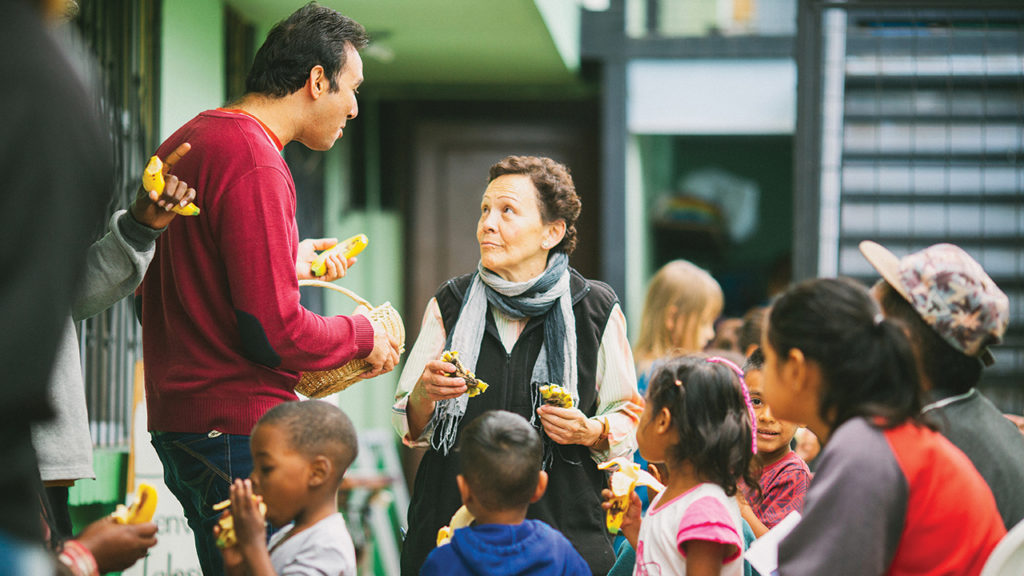 María Helena López, center, worked with others at Quito Mennonite Church to share food with refugees who traveled to Ecuador from Colombia and Venezuela in 2019. López was sent by the Colombia Mennonite Church, a partner with Central Plains Mennonite Conference and Mennonite Mission Network in an Ecuador partnership. — Jon Carlson