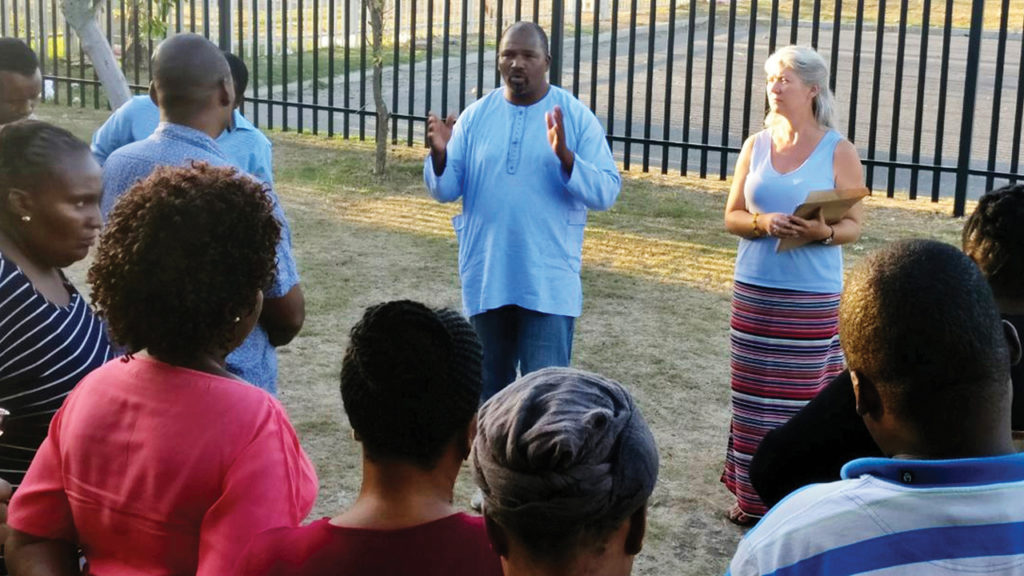 Oscar Siwali addressed participants in the Lwandle Leaders Community Conflict Transformation workshop with MMN worker Kathryn Smith Derksen in 2019. — Mennonite Mission Network