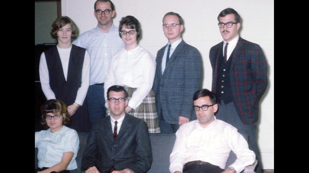 Mennonite House volunteers, 1966. Sitting, from left: Joyce Good, Bob Souder, Don Bender. Standing: Christine Schumacher, Hal Hess, Mary Yoder, Tim Yoder, Dave Shields. — Hal Hess