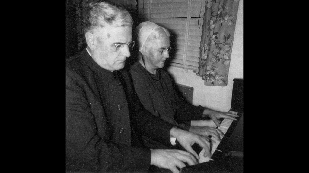 Siblings Chester Lehman and Elizabeth Lehman Kurtz play the piano in 1952. — Lehman family