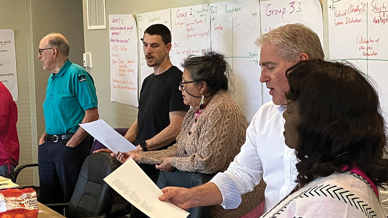 Mennonite Church USA Executive Board members Mitch Kingsley of Bluffton, Ohio, Todd Lehman of Hesston, Kan., Susan Hart of El Reno, Calif., Jim Caskey of Goshen, Ind., and Zenobia Sowell-Bianchi of Chicago sing a hymn April 14. Photo: Paul Schrag/AW