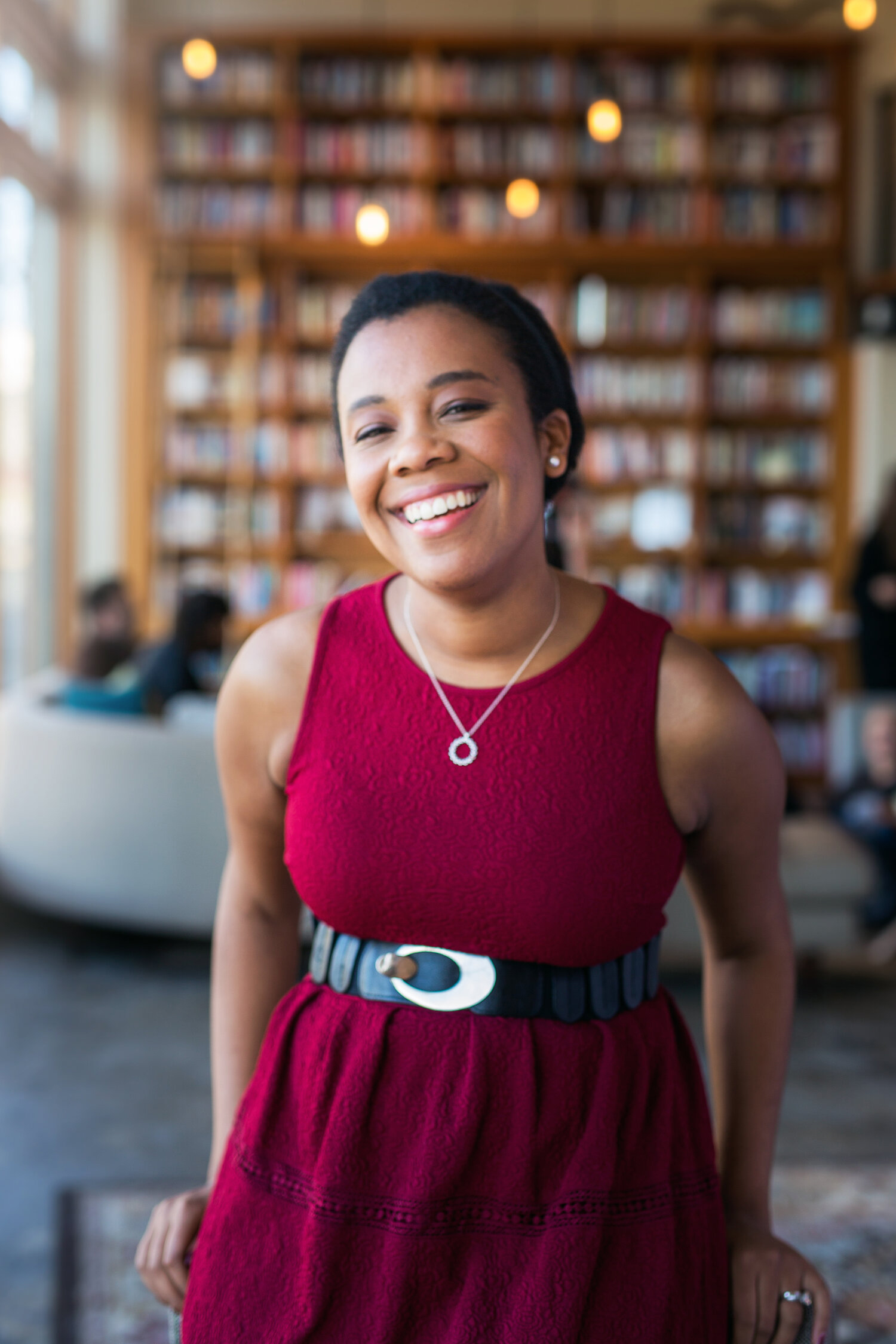 Photo of the Rev. Jennifer Bailey in a maroon dress.
