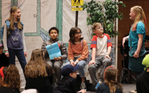 Schoolchildren try to figure out the mission left for them in an anonymous note during the performance of Mission Possible: Sharing the Gospel by Our Love on March 12 at Silverwood Mennonite Church in Goshen, Ind. — Jason Potsander