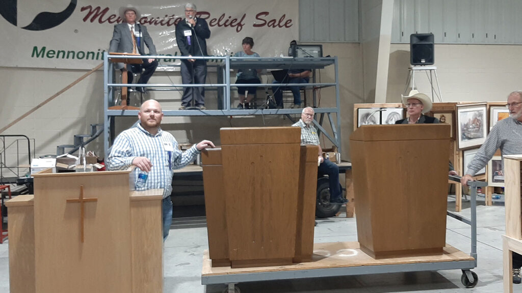 Auctioneers call for bids for podiums from Trinity Mennonite Church April 15 at the Kansas Mennonite Relief Sale. — Laurie Oswald Robinson