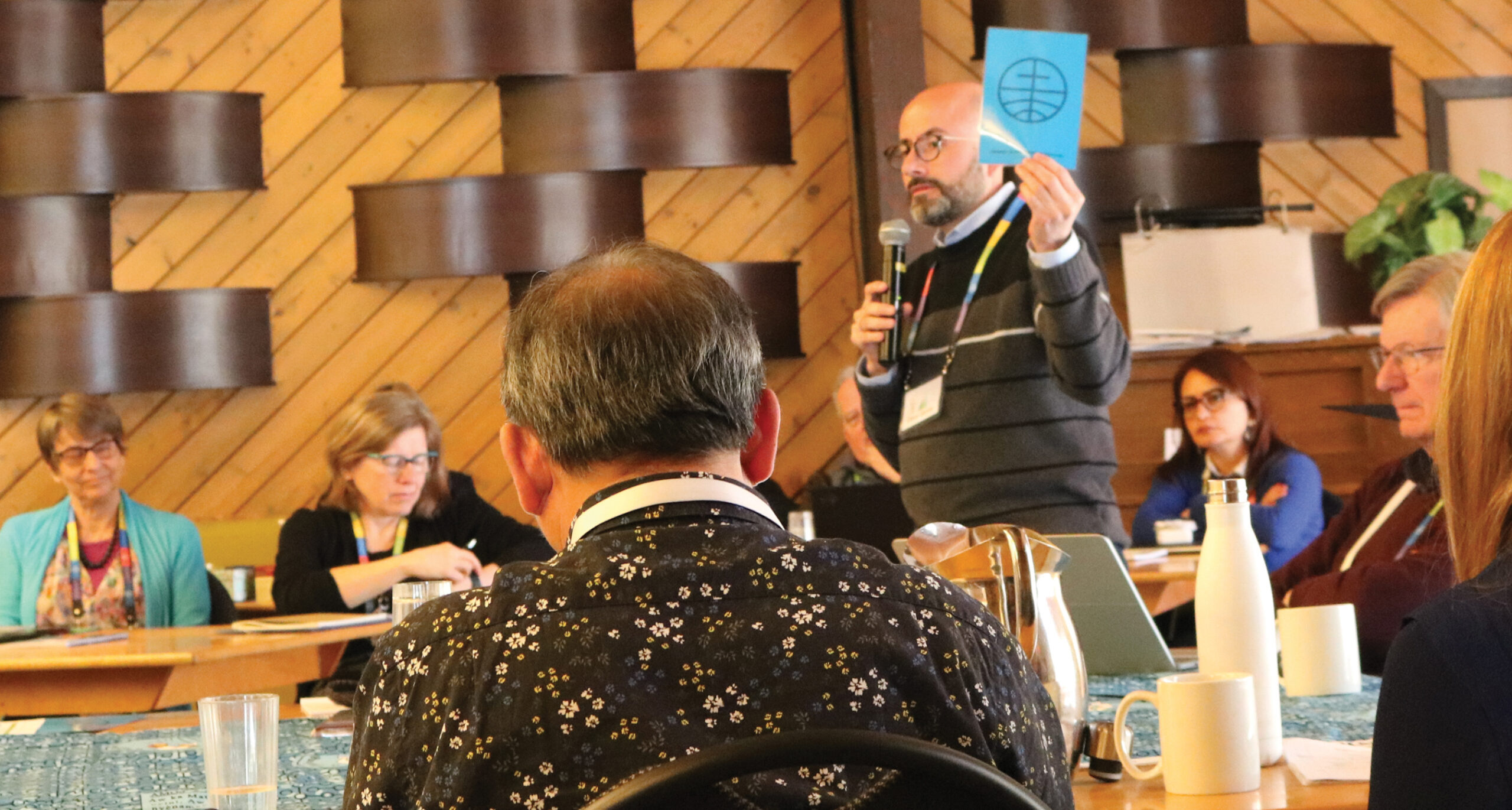 Mennonite World Conference general secretary César García leads a presentation during Executive Committee meetings at Camp Squeah in British Columbia. — Karla Braun/MWC