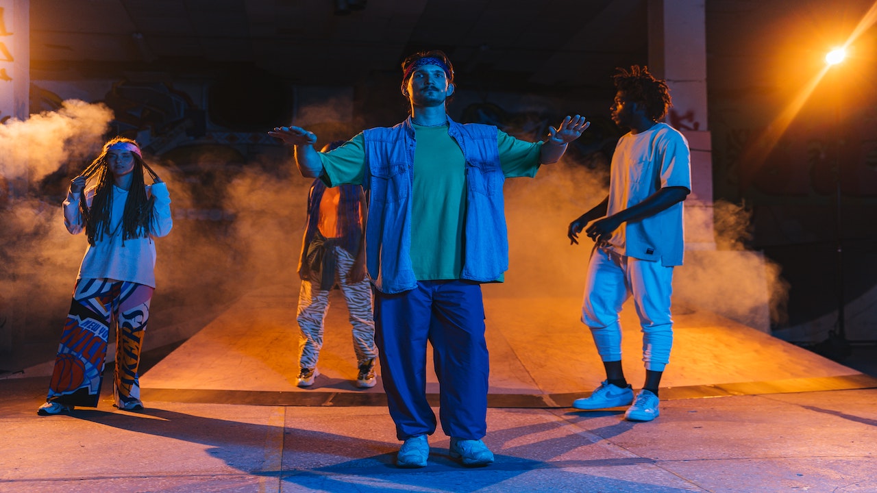 group of dancers in trendy clothing