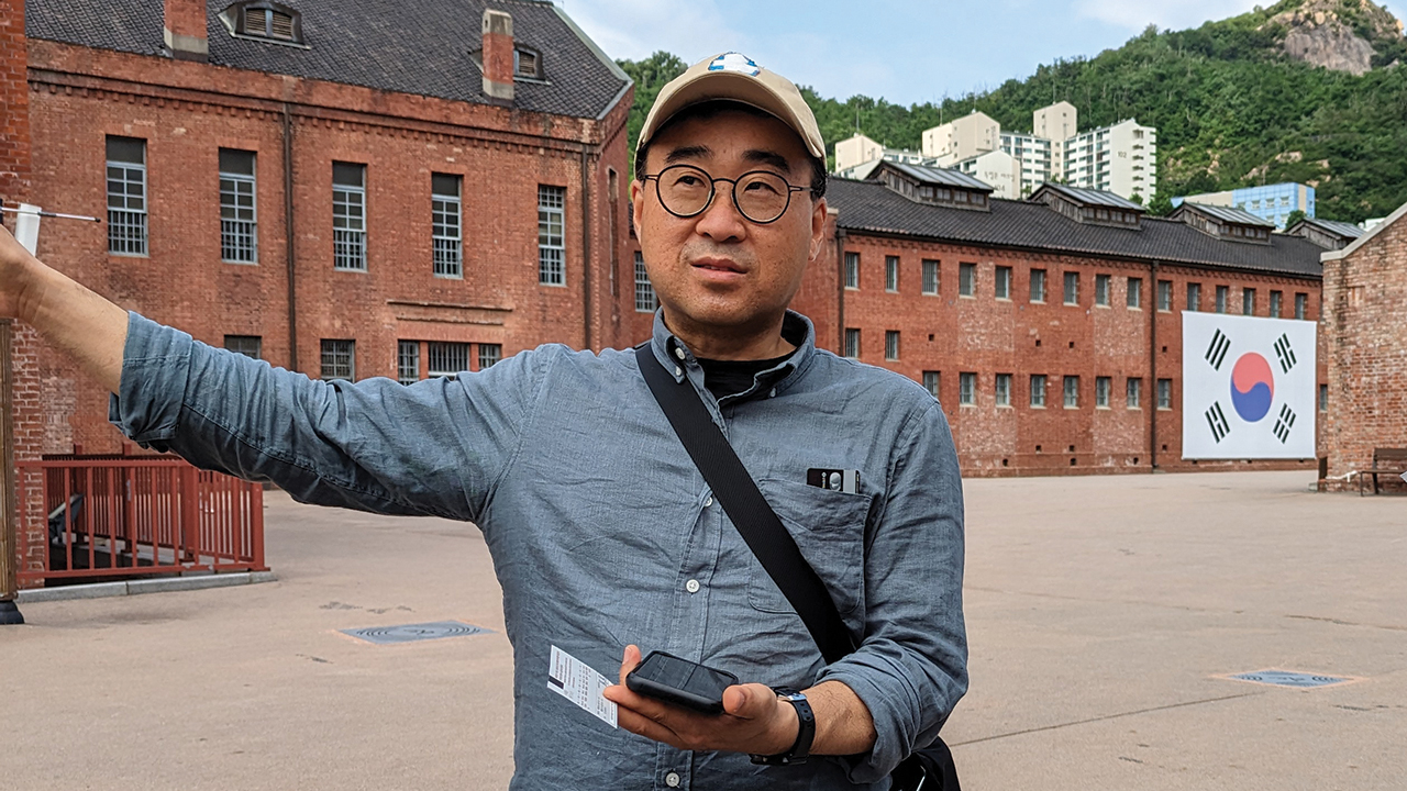Mennonite Central Committee Northeast Asia representative SeongHan Kim speaks about his family’s history at Seodaemun Prison in Seoul, South Korea. — Tim Huber/AW