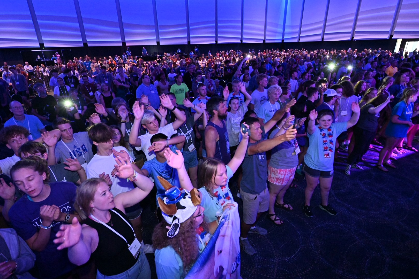 Youth worship together at MennoCon23. - Mennonite Church USA