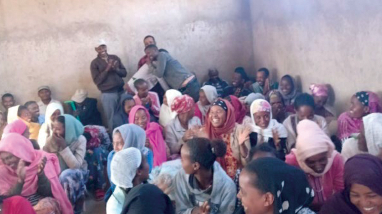 Dechassa embraces his neighbor Taye, whom he wanted to kill before attending a preschool parents’ meeting focused on Jesus and peacebuilding. — Meserete Kristos Church News