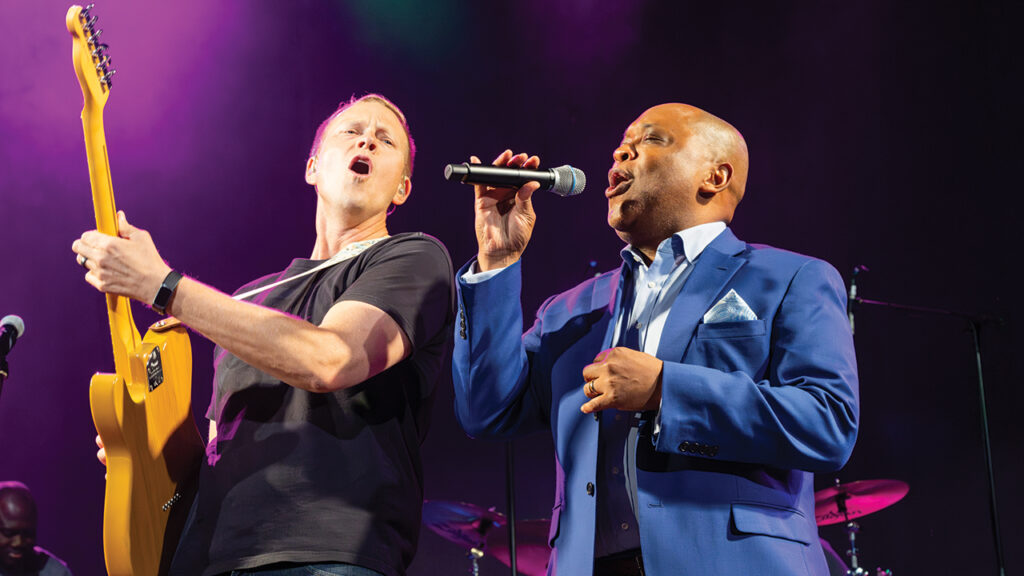Mennonite Church USA executive director Glen Guyton, right, joins worship team member Jeremy Kempf in “Freedom (I Wanna Clap a Little Louder).” — Ken Krehbiel/MC USA