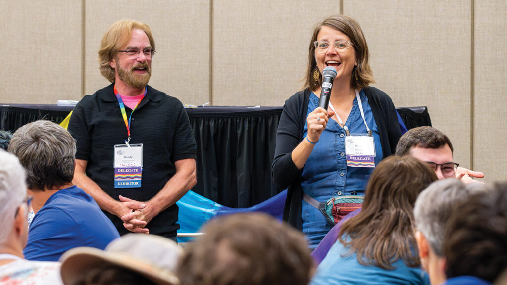 At a seminar on “Living into Repentance and Transformation,” Megan Ramer, pastor of Seattle Mennonite Church, speaks about her congregation giving its former Mennonite Voluntary Service house to the Trans Women of Color Solidarity Network. At left is seminar leader Randy Spaulding, pastor of Boulder Mennonite Church in Colorado and a member of the Inclusive Mennonite Pastors leadership team. — Ken Krehbiel/MC USA