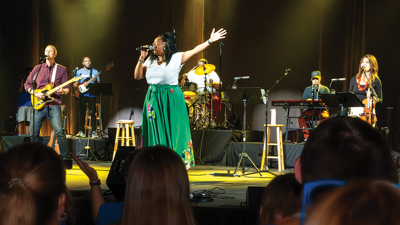 MennoCon23 band members Jeremy Kempf of Phoenix, Jermaine Figueroa of Houston, Nicole Francisco Bailey of Hampton, Va., Onan Alvarez of Houston, Edwin Rodriguez of Houston and Hillary Harder of Elkhart, Ind., lead worship during the 2023 Mennonite Church USA convention. — Ken Krehbiel/MC USA