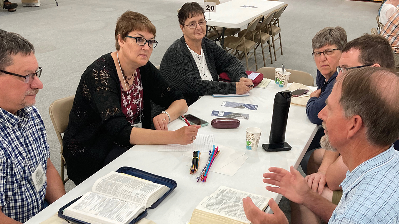 Central Plains Mennonite Conference delegates talk during the 2022 annual meeting in Freeman, S.D. — Ted Lewis
