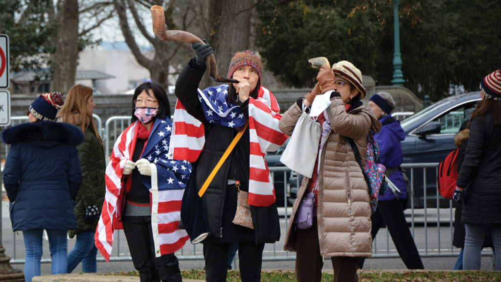 Women blow shofars during a “Jericho March” on Jan. 5, 2021, in Washington. Religious supporters of President Donald Trump marched around the U.S. Capitol in imitation of the biblical account of Israelites besieging the city of Jericho in the Book of Joshua. — Jack Jenkins/Religion News Service