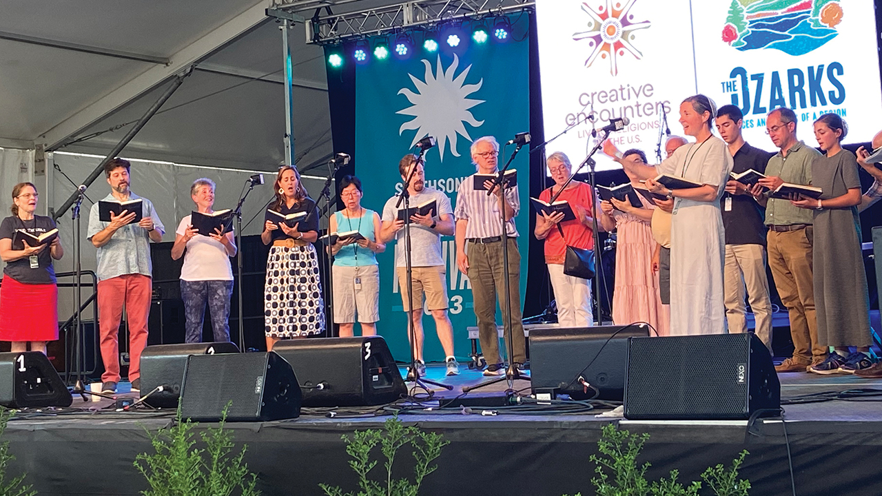 Faith Zook of Hampden Mennonite Church leads a community hymn sing July 3 during the Smithsonian Folklife Festival in Washington, D.C. — Jane Moya