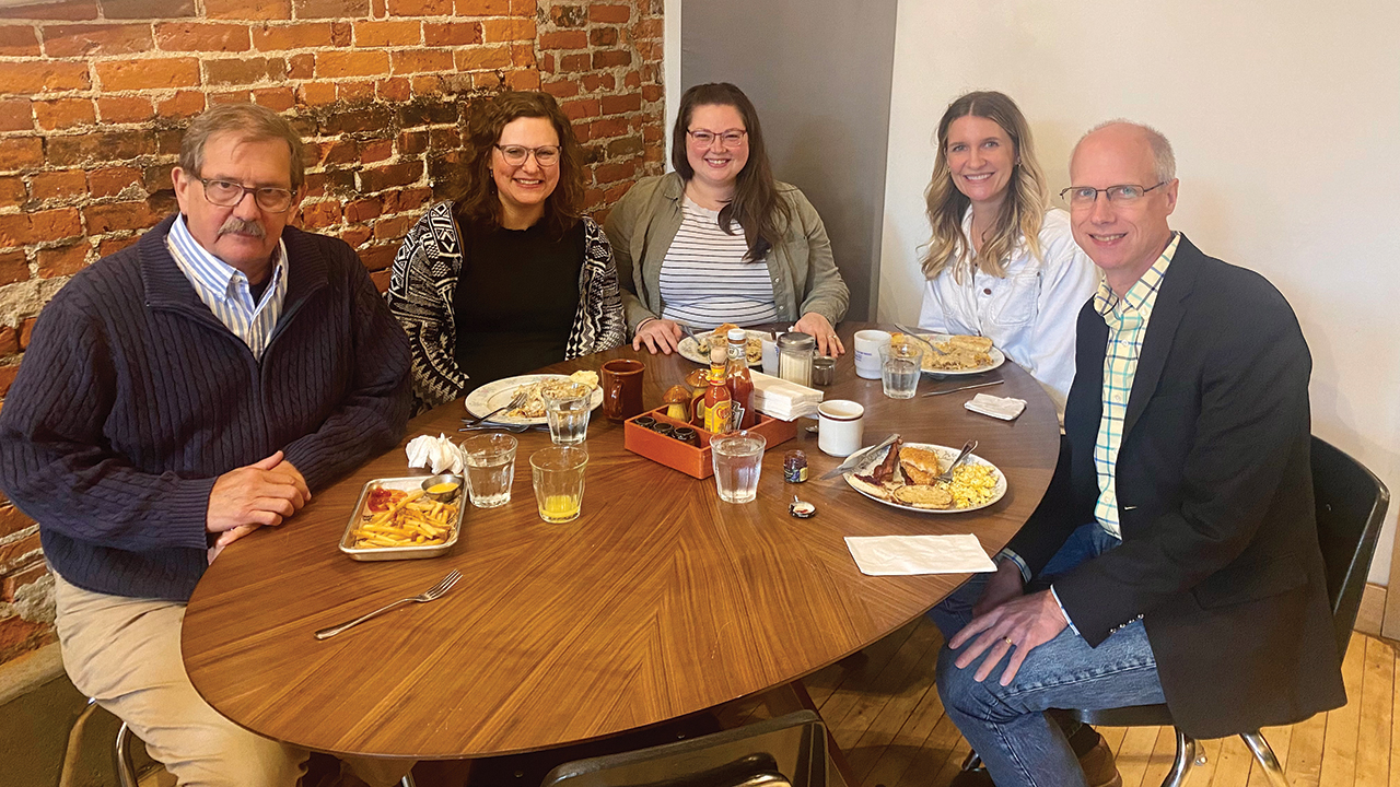 Anabaptist World editor Paul Schrag, right, and executive director Danielle Klotz, center, with former executive directors/editors of The Mennonite — Everett Thomas, Hannah Heinzekehr and Anna Groff — in Elkhart, Ind., in March. — Anabaptist World