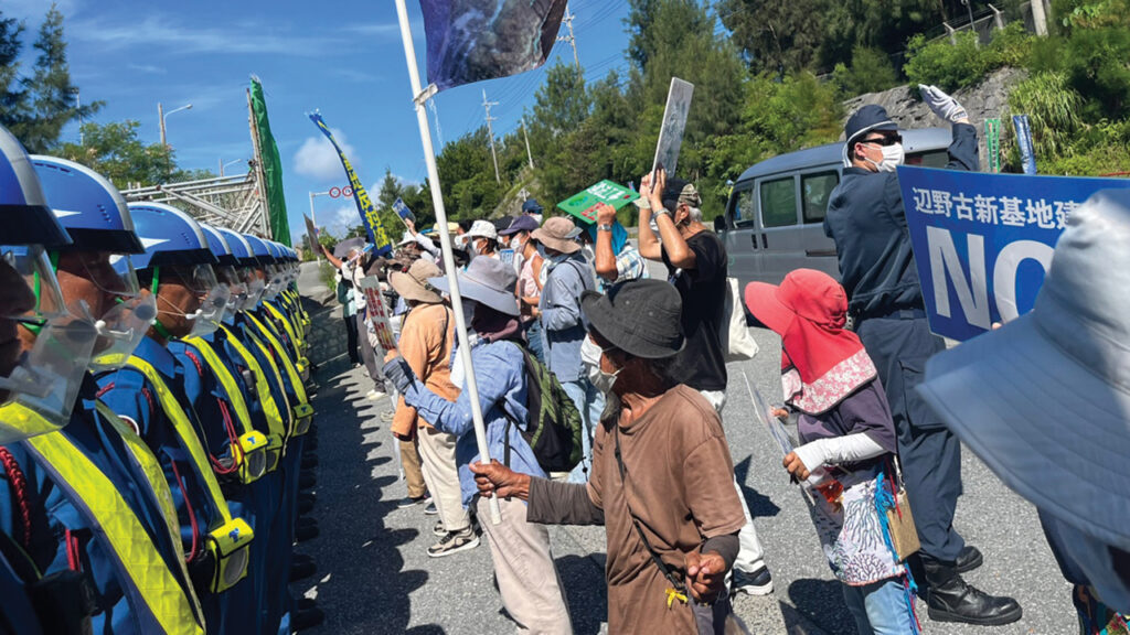 The crew of Jonah’s Whale joins citizens of Henoko Bay July 19 in Okinawa, Japan, to protest the expansion of a U.S. military base by blocking dump trucks hauling sand to create more land in the ocean. The Nation reported in 2021 that the land being used to extend the base comes from a battlefield filled with human remains. — Project Gongpyeong-hae