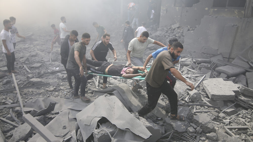 Palestinians evacuate wounded people Oct. 12 after an Israeli airstrike in Rafah refugee camp, southern Gaza Strip. — Hatem Ali/AP