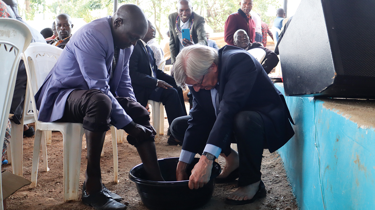 Mennonite World Conference President Henk Stenvers, right, washes the feet of Kenya Mennonite Church elder Ole Koringo. — Mennonite World Conference
