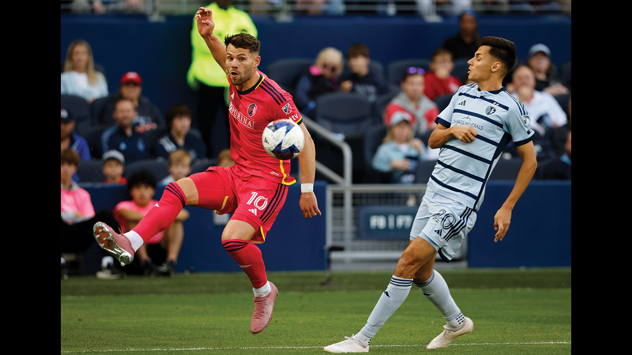 St. Louis City midfielder Eduard Löwen (10) passes the ball as Sporting Kansas City forward Dániel Sallói (20) defends Nov. 5 in Kansas City, Kan. — Colin E. Braley/AP