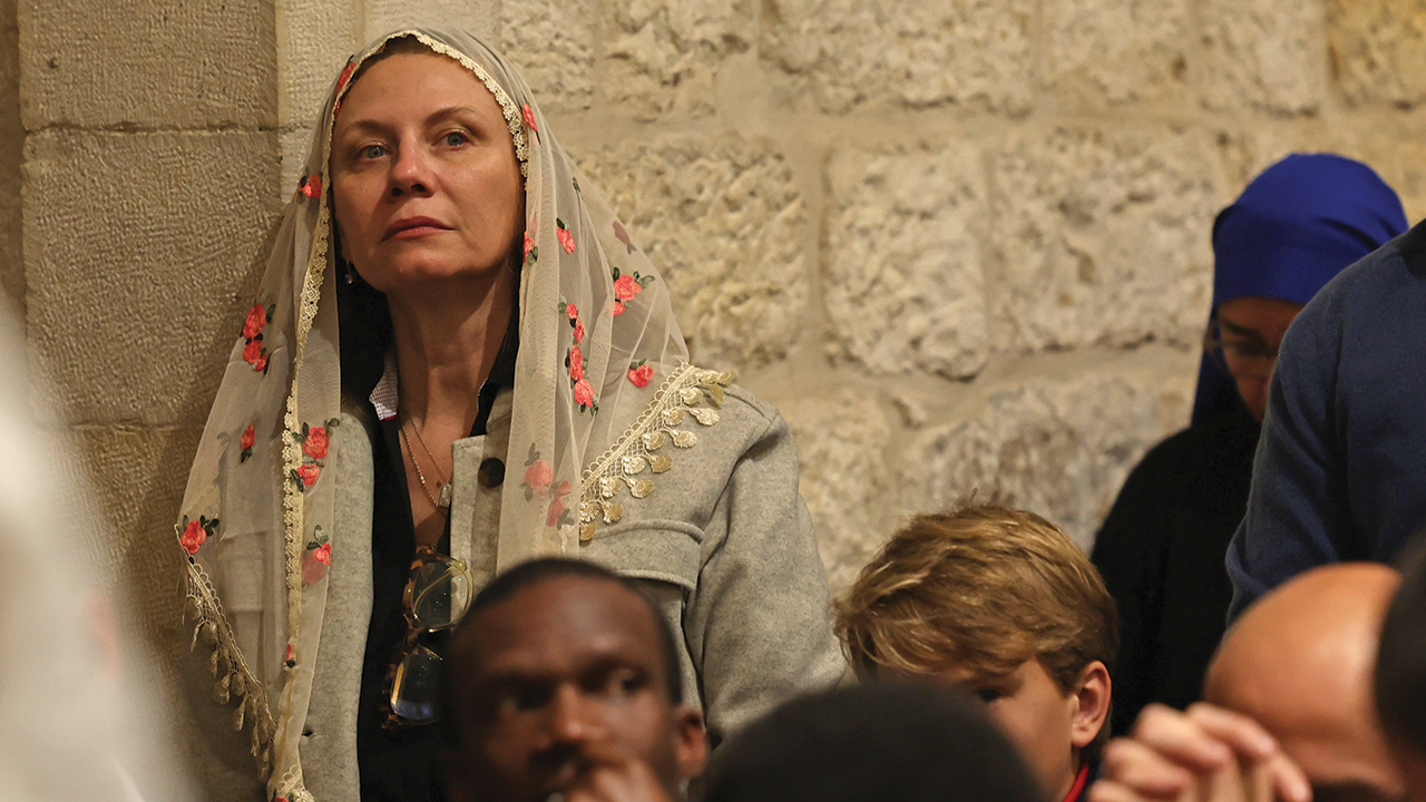 Worshipers attend a Christmas midnight Mass at the Church of the Nativity compound in the West Bank town of Bethlehem on Dec. 25, 2022. — Ahmad Gharabli/AP