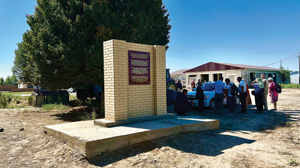 At Ak Metchet, a new sign with text in four languages celebrates peaceful coexistence. — John Sharp