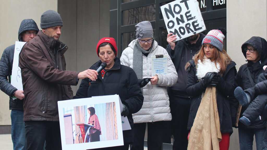 Lydia Brenneman speaks during a demonstration outside Sen. Sherrod Brown’s office in Columbus, Ohio. — Sara Werner
