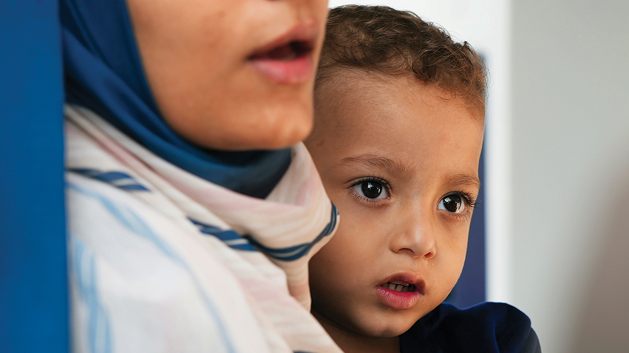 Ahmed al-Amassi, 2 years old, injured in the Israel-Hamas war, sits in an ambulance with his mother in Abu Dhabi, United Arab Emirates, on Nov. 18. Ahmed was among a group of children who were able to leave the Gaza Strip for treatment. — Malak Harb/Associated Press
