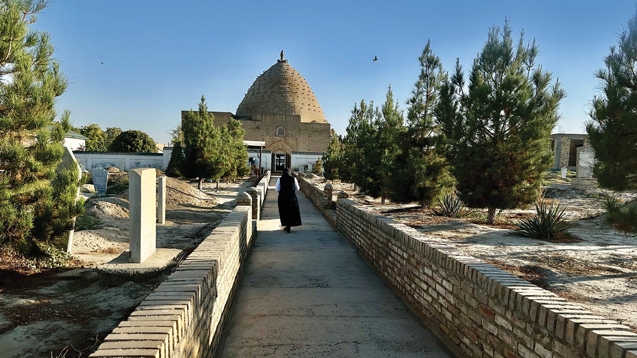Elizabeth Enns of Aylmer, Ont., walks to Kyk Ota Mosque through a cemetery at Zirabulak where several Mennonites were buried in the 1880s. — John Sharp