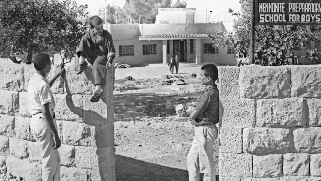 Boys stand outside by the entrance to Mennonite Preparatory School for Boys, Beit Jala, in the West Bank, in 1968. MCC opened the preparatory school in 1962 to provide Christian education to Palestinian children. The school received funding through MCC’s child sponsorship program. In 1976 MCC transferred administrative responsibility to a Palestinian Christian organization, the Arab Charitable Society, a move that brought a name change to Hope Secondary School. — Mennonite Central Committee