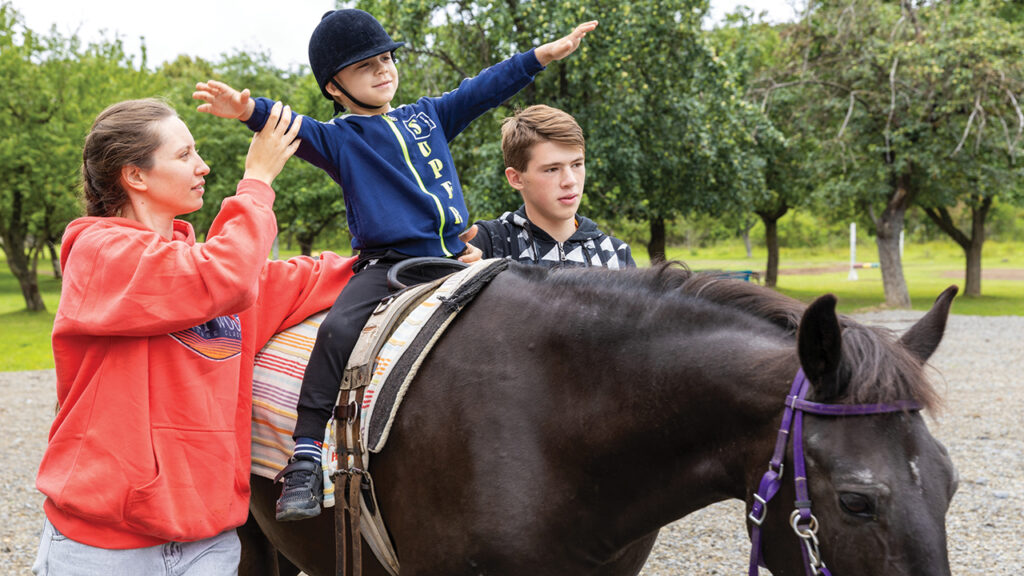 This 6-year-old child, who has developmental delays, became more communicative and calmer through his riding experience, his mother said. Through massage, his fear of touch receded. — Association of Mennonite Brethren Churches of Ukraine