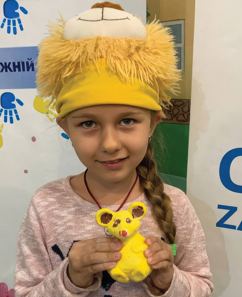 Ulya,* who was separated from her cat during the war, holds a clay cat she made at Nevo. — Courtesy of Nevo
*The full name of the child pictured is not provided for security reasons.
